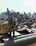 Tan Son Nhut, Vietnam, 1968. A twelve year old Vietnamese ARVN Airborne trooper who had been 'adopted' by the Airborne Division, holding a M-79 grenade launcher. The picture was taken during a sweep of an Airborne Task Force Unit through the devastated area surrounding the French National Cemetery on Plantation Road after a day long battle there.